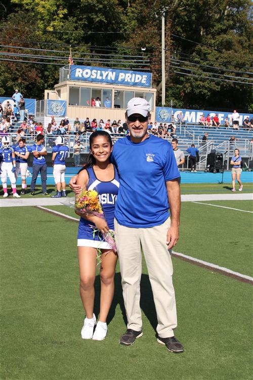 Senior Cheerleader with football coach 