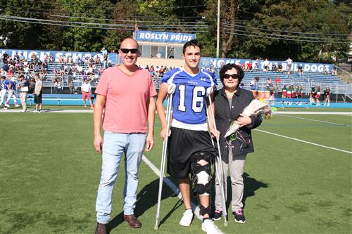 Senior football player and family 