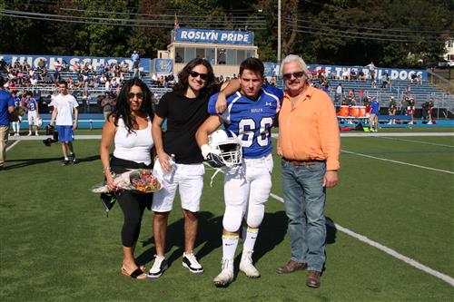 Senior football player and family 