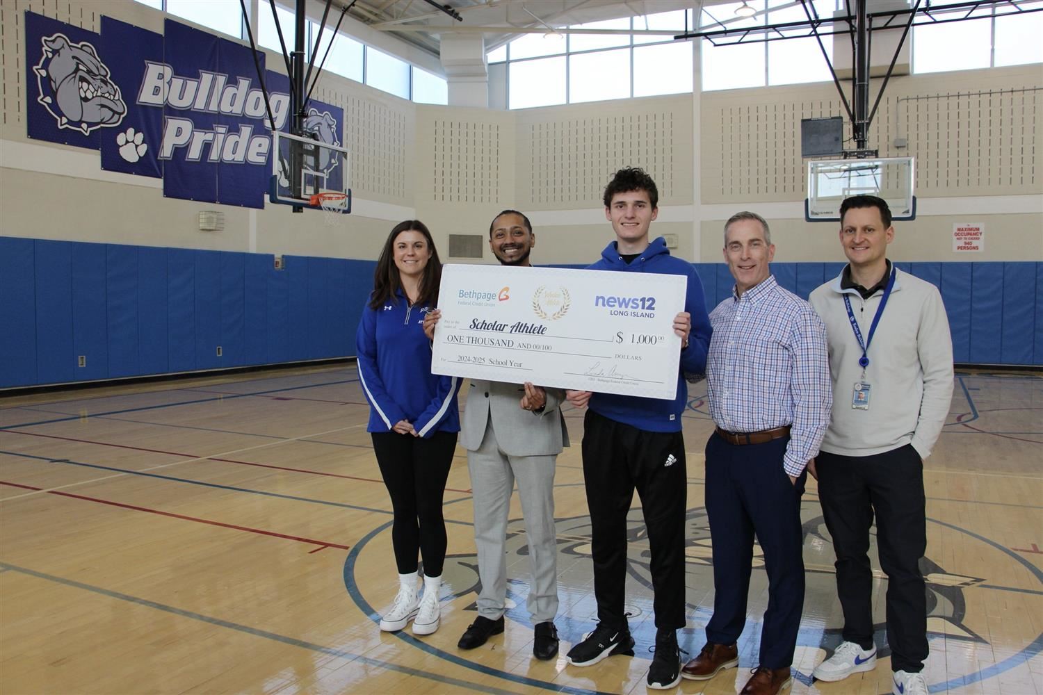  zach with big check