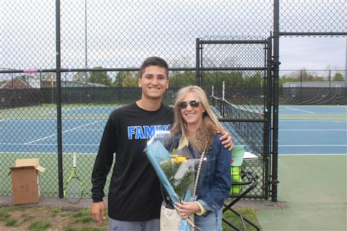 Senior tennis player and family 