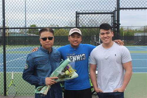 Senior tennis player and family 