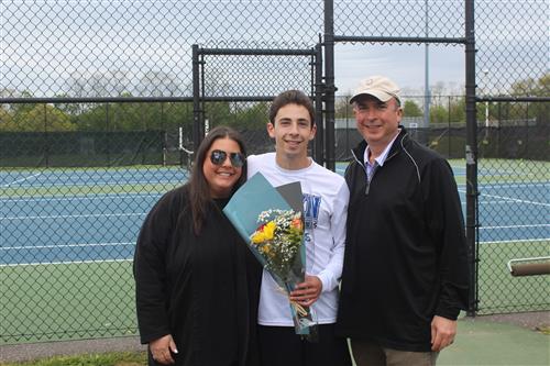 Senior tennis player and family 