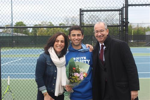 Senior tennis player and family 