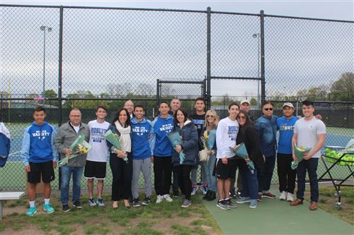 Senior tennis players and family 