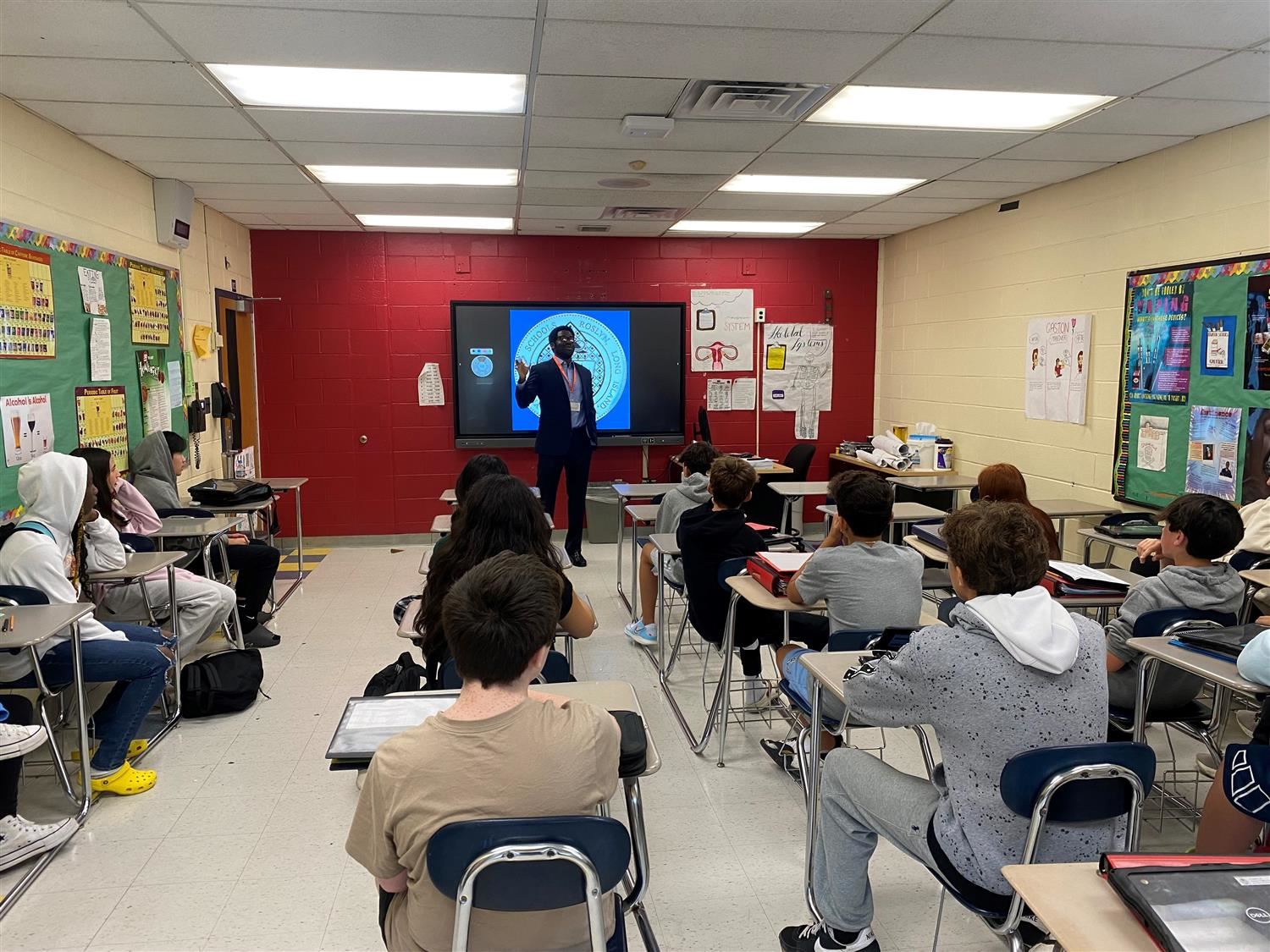 Speaker at front of class