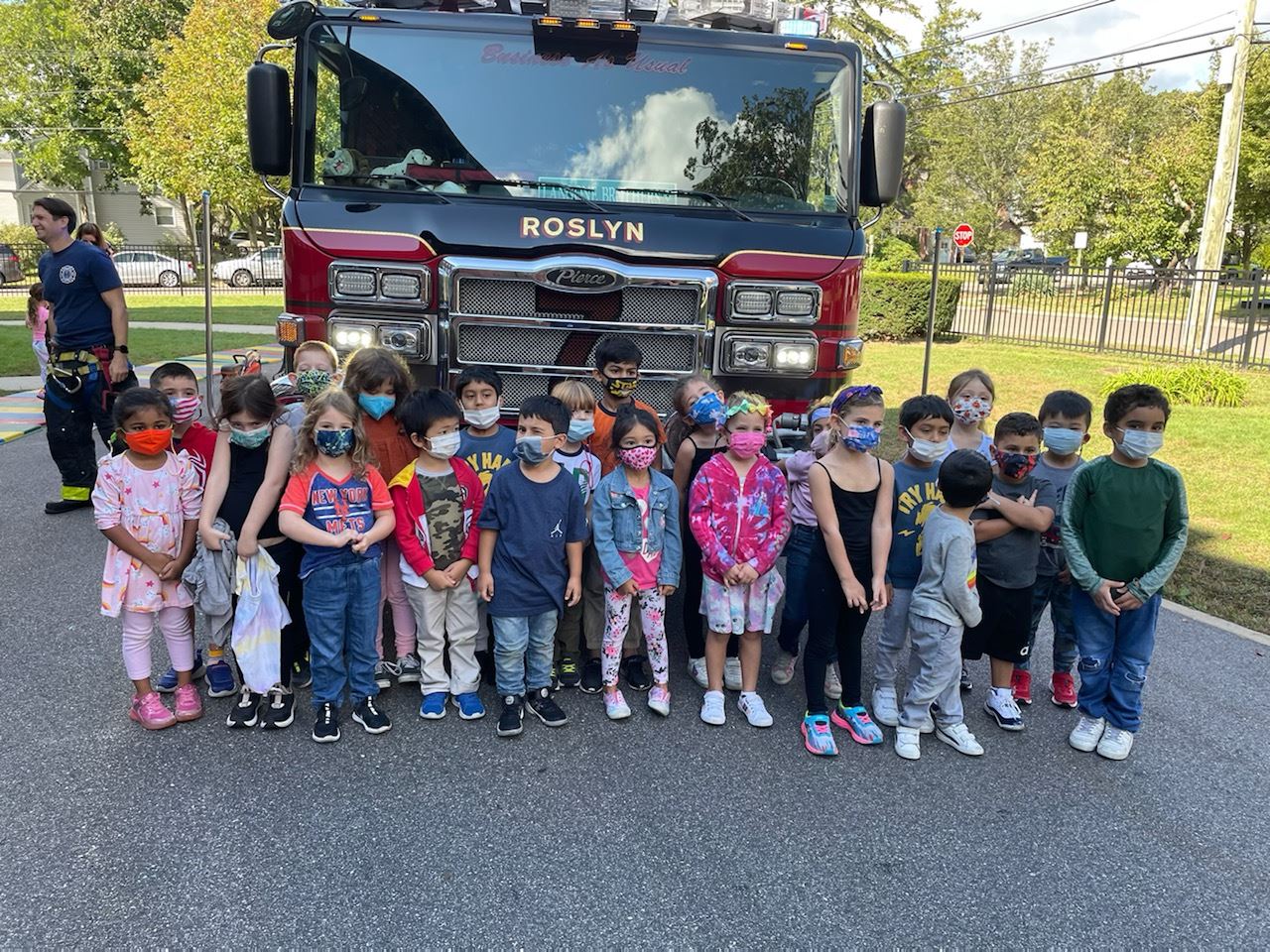  group shot in front of fire truck