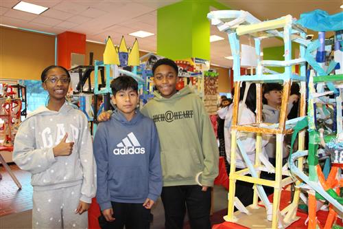 3 students with coasters