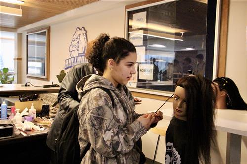student braiding hair