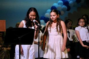 two girls at mic