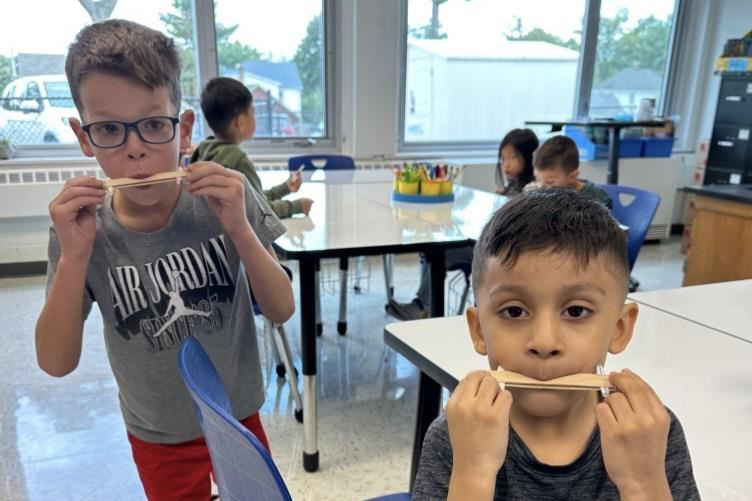  two kids with kazoos